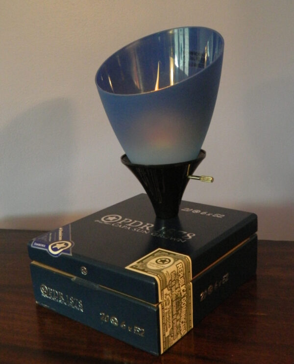 A Blue PDR Cigar Box Lamp with an uplight blue shade and a soft glow. A great gift for Jazz Lovers.