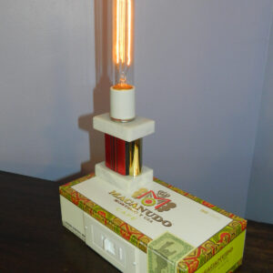 Macanudo Cigar Box Lamp is topped by a red trophy and lots of light. An unusal gift for him.