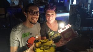 A mother and son display the cigar box lamps they built at a Build & Brew event.