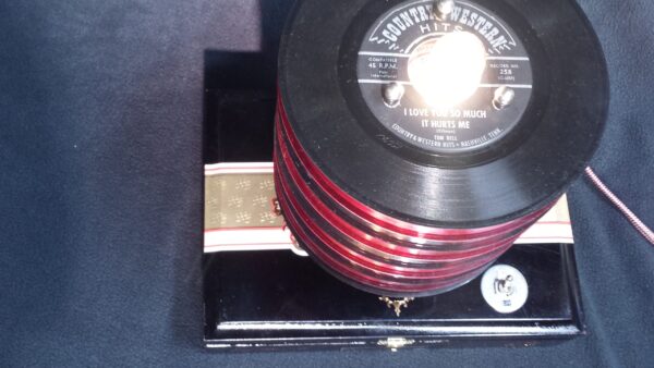 A top down view of Red & Black 45 records on top of this black My Father cigar box. Perfect Vinyl Collector Gift