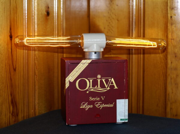 Crafted from a deep red Oliva cigar box, this unique lamp has two light bulbs mounted on top in the configuration of a old-fashioned dynamite plunger handle.