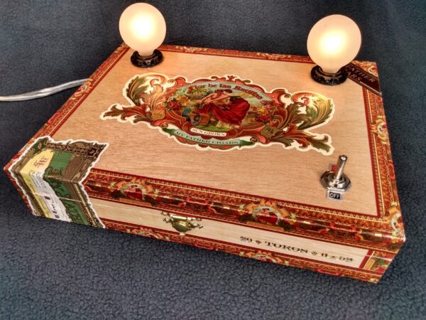 A beautiful cigar box lamp with 2 bulbs. Crafted from a Flor de las Antilles My Father Cigar box.