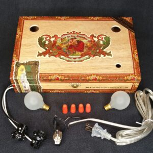 A Flor del las Antilles Cigar Box Lamp Kit with all the parts needed to create a lamp.