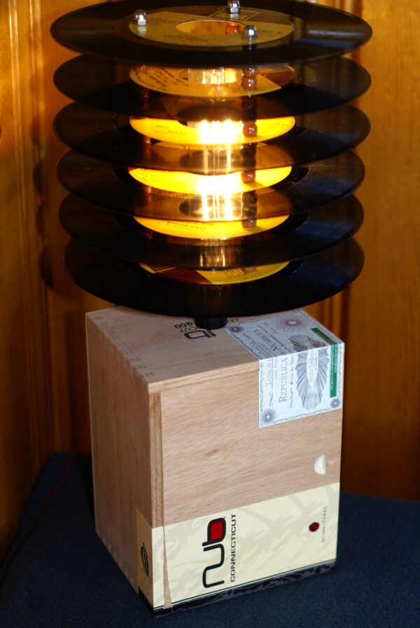 Mellow Yellow Cigar Box Record Lamp. A plain wood Nub cigar box lamp topped by a shade made from 45 records with yellow labels.