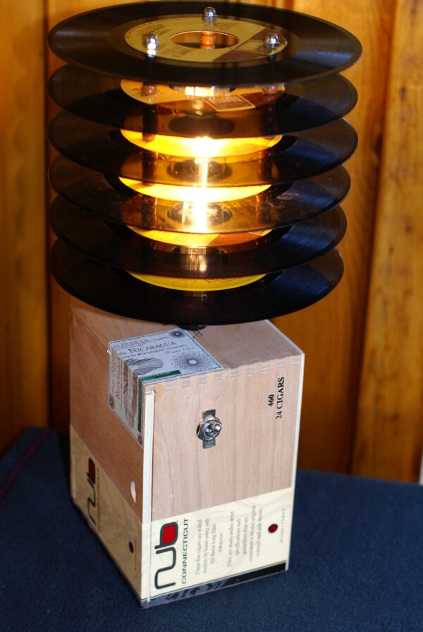 Mellow Yellow Cigar Box Record Lamp. A plain wood Nub cigar box lamp topped by a shade made from 45 records with yellow labels.